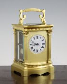 A French ormolu carriage clock, with serpentine fronted fluted column case, the movement striking on