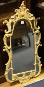 An 18th century North European cream painted wood and Carton-Pierre mirror, with gilt scroll