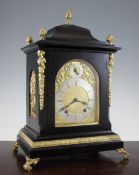 An Edwardian 18th century style ebonised bracket clock, with arched gilt dial and W & H movement,