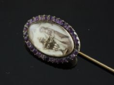 A George III ivory and amethyst memorial pin, with inked ivory panel depicting a woman beside an