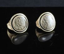A rare pair of George III enamelled gold memorial rings, with centres of pale plated hair within