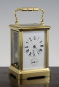 A gilt brass hour repeating carriage alarm clock, with enamelled Roman dial and French movement, 5.