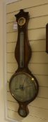 A Regency banded mahogany wheel barometer, with silvered hydrometer, thermometer, dial and level