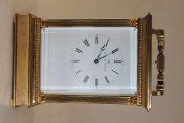 A Matthew Norman hour repeating brass carriage clock, with fluted columns, enamelled dial and