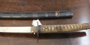 A Japanese katana, 19th century, with black lacquered scabbard, pierced iron tsuba and other gold