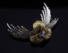 An Italian 18ct two colour gold, sapphire and diamond set brooch, of foliate design, 2in, gross 13.4