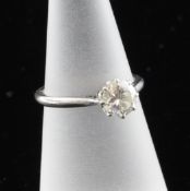 An 18ct white gold and platinum solitaire diamond ring, the brilliant cut stone approximately 0.