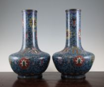 A pair of large Chinese cloisonne enamel vases, 19th century, of onion form, decorated with lotus