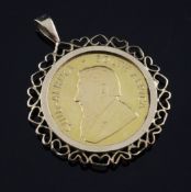 A 1981 gold Krugerrand, in 9ct gold pendant mount with heart shaped border.