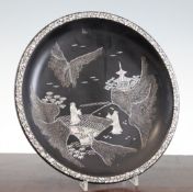 A Chinese lac burgaute circular dish, late 19th / early 20th century, inlaid with mother of pearl,