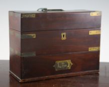An early 19th century brass bound mahogany apothecary cabinet, with hinged lids and drawer enclosing
