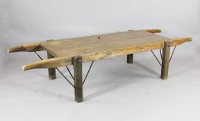 A 19th century pine pig carrier, with two plank top on square legs, SIZE