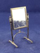 A George V miniature silver model of a cheval mirror, with urn finials and arched stretcher, John