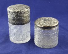 A Victorian silver mounted cylindrical glass toilet jar, embossed with florets and scrolls,