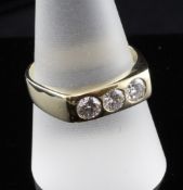 A 14ct gold and three stone gypsy set diamond ring, total diamond weight approximately 0.60ct,