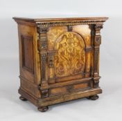 A large 18th century Dutch inlaid walnut cabinet, with arched panelled doors above a drawer, on
