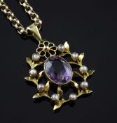 An Edwardian gold, amethyst and seed pearl pendant, of oval foliate form, on gold oval link chain,