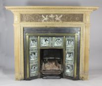 A Victorian cast iron and brass fire insert, inset with eight Minton tiles by Moyr Smith decorated
