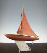 A 1940`s model wood and painted metal pond yacht, 26.5in.