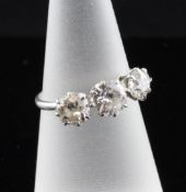 An 18ct white gold three stone diamond ring, total diamond weight approximately 1.20ct, size L.
