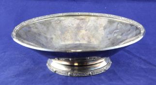 A George VI silver circular bowl, with Celtic ruin, on conforming circular foot, Atkins Bros,