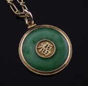 A 20th century gold mounted jadeite disc pendant, with central Chinese characters, 1in, on earlier