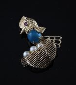 A gold, turquoise, ruby and cultured pearl set brooch, modelled as a chicken with a nest of eggs,