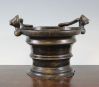 A Flemish bronze water stoup, of Gothic design, the ribbed tapering cylindrical body with trefoil