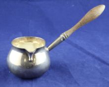 A George II? silver brandy warmer, with bulbous body and turned wooden handle, marks rubbed, (