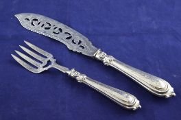 An ornate pair of Victorian silver fish servers, with pierced and chased decoration, John Gamage,