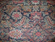 A Caucasian carpet, with extensive polychrome field of geometric motifs, on a beige ground, with