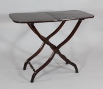 A Victorian mahogany folding coaching table, on serpentine legs, 2ft 2in. x 2ft 11in.