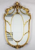 A neo-classical revival urn shaped giltwood mirror, 4ft 1in. x 2ft 3in.