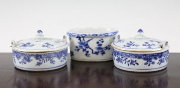 A pair of Chinese export blue and white circular butter tubs and covers, and a similar oval dish,