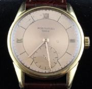 A gentleman`s 1950`s 18ct gold Patek Philippe wrist watch, the rose gold coloured dial with baton