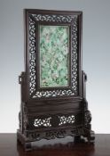 A Chinese `jade` and hardwood table screen, the panel carved in high relief with dragons around