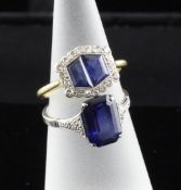 A 1920`s sapphire and diamond hexagonal dress ring, with two shaped sapphires bordered by