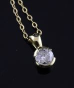 An 18ct gold and brilliant cut diamond pendant, on a 9ct fine link chain, 16in.