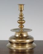 A Nuremberg brass bell based candlestick, late 16th / early 17th century, by Stephen Schirmer, the