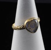 A Charles II gold memorial ring, with chased shank showing traces of blue enamel and a heart