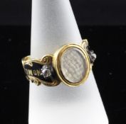 A Victorian diamond, enamel and gold memorial ring, with hairwork panel and black enamelled shank