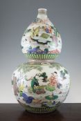 A large Chinese famille verte double gourd vase, painted with sages in garden landscape settings,