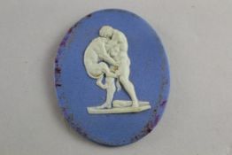 An Enoch Wood jasper oval plaque, late 18th century, depicting Heracles wrestling a lion,