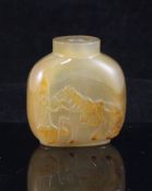 A Chinese chalcedony snuff bottle, late 19th/early 20th century, carved in high relief with a