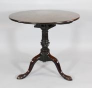 A George III mahogany tilt top occasional table, with birdcage on a turned column and tripod base