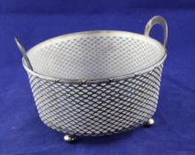 A 20th century American pierced sterling silver two handled circular dish, in the form of a