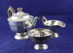 An Edward VIII silver pedestal tea set, of circular form with panelled bodies, Viners Ltd,