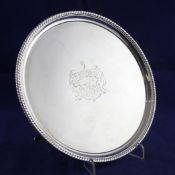 A George III silver salver, with gadrooned border and later engraved armorial, incuse duty mark,