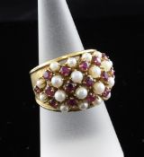 A continental 18ct gold, ruby and cultured pearl cluster dress ring, with matt finish gold shank,