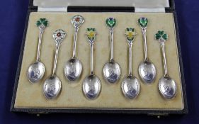 A cased set of eight silver and enamelled teaspoons, to commemorate the Coronation of Queen